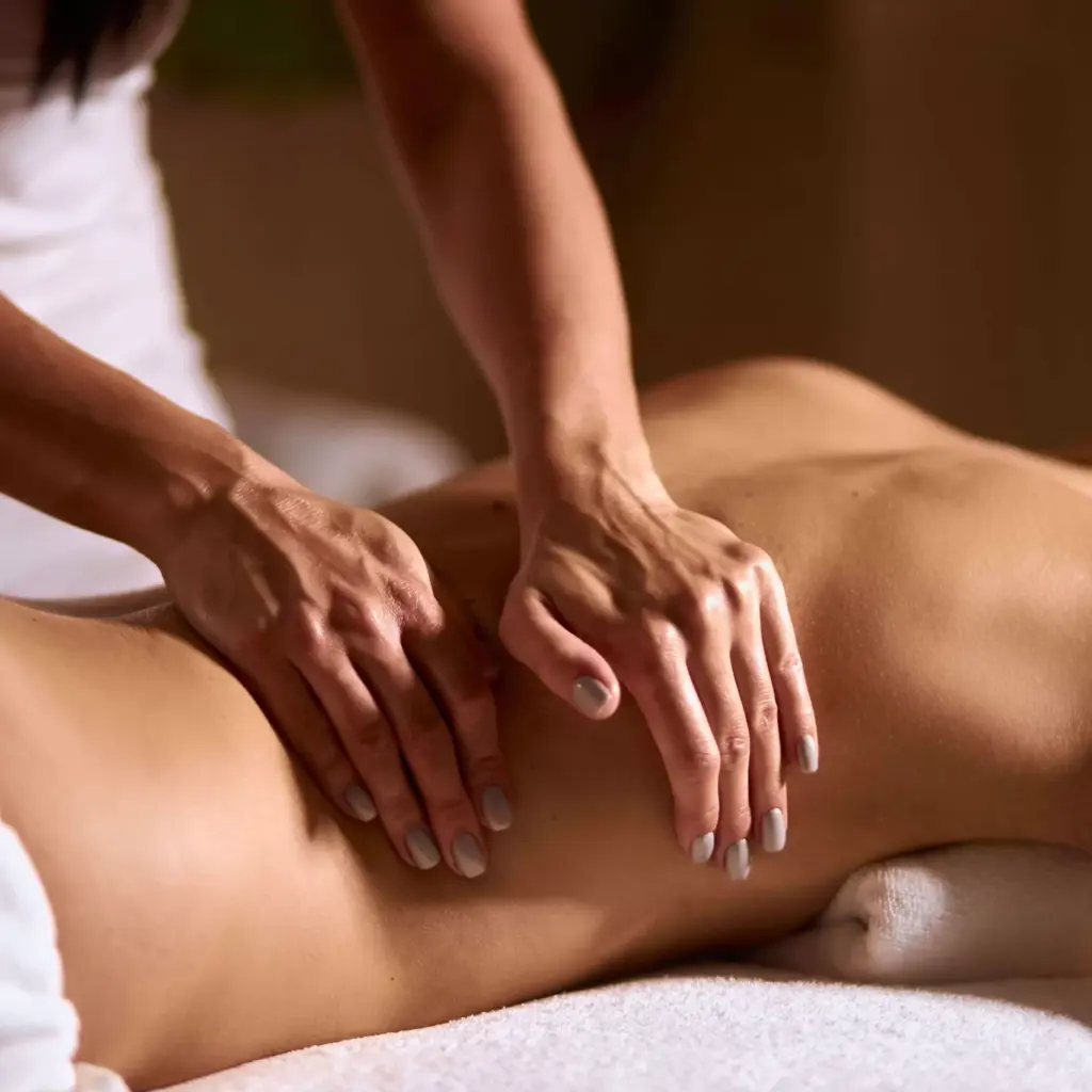 Person receiving a relaxing massage on the back at a spa